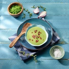 Crème van groene erwten met gebakken spek