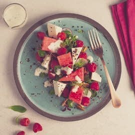 Watermeloen salade met ricotta, frambozen en een slagroomdressing