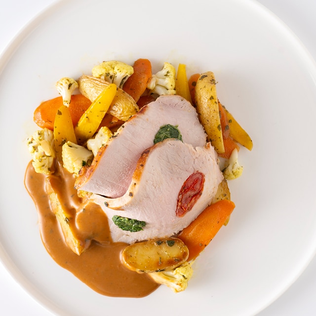 Italiaans varkensgebraad met gegrilde groenten en krielaardappelen